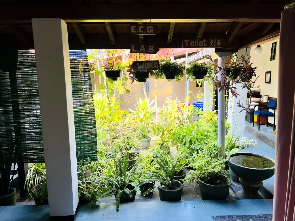 Garden entrance and potted plants near the clinical areas